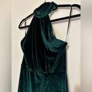 Emerald green velvet dress.